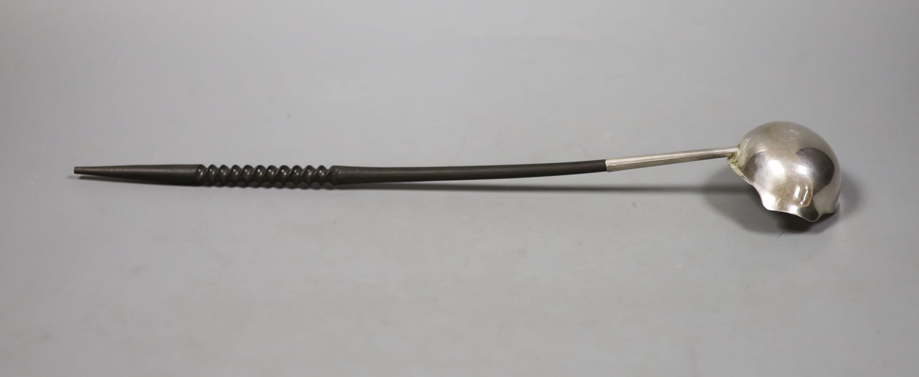 A George II silver toddy ladle with later? turned handle, maker, I.W, London, 1752, 39.4cm.